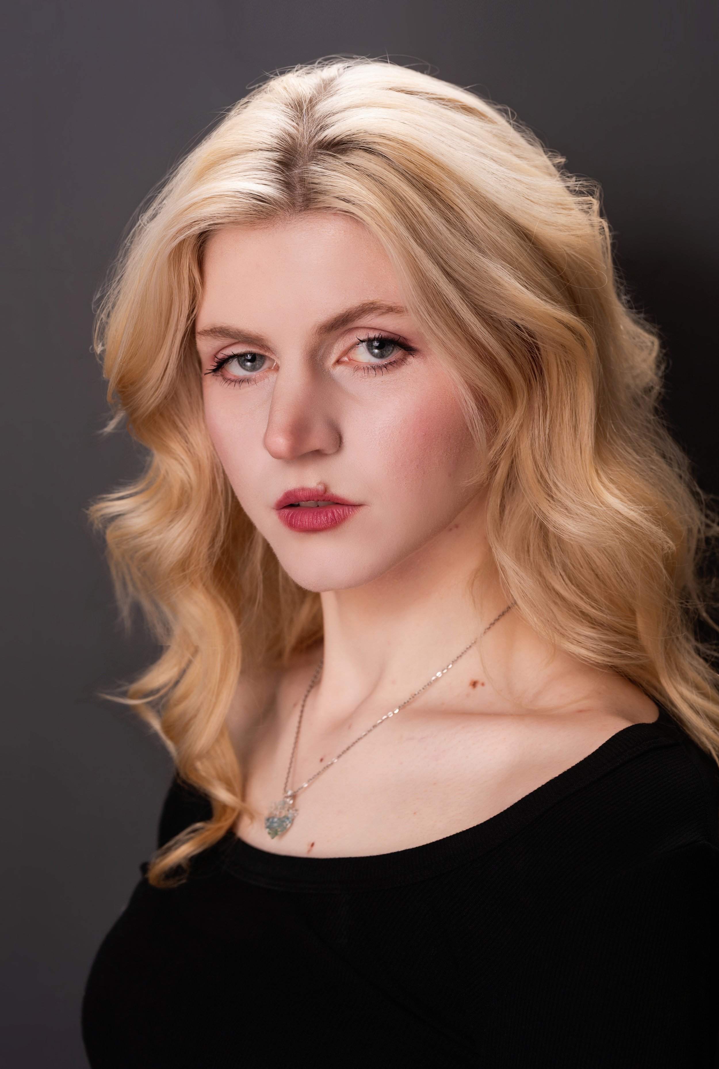 Astraea Headshot Black bg.JPG