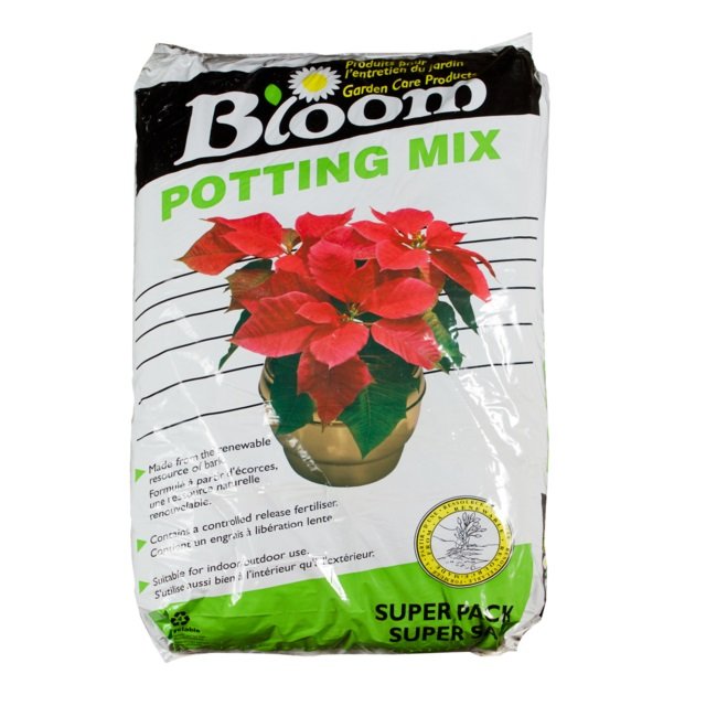A bag of Bloom potting mix with a picture of a potted poinsettia plant on it.