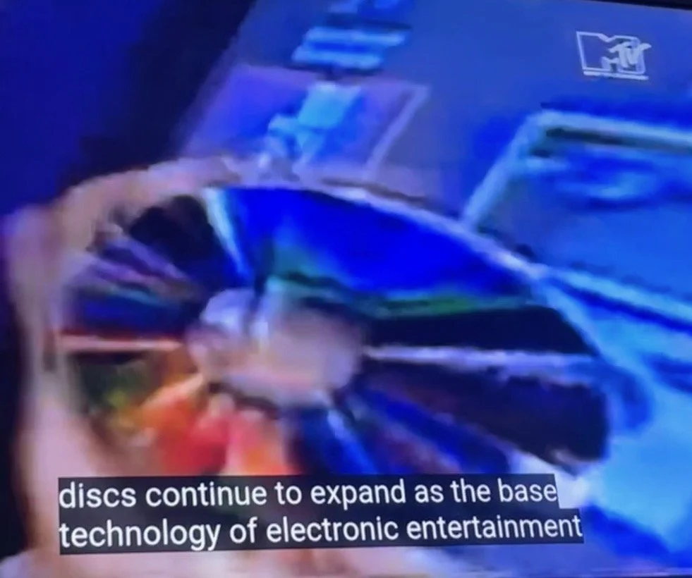 Early 1990s screen shot of MTV news segment that states, "discs continue to expand as the base technology of electronic entertainment."