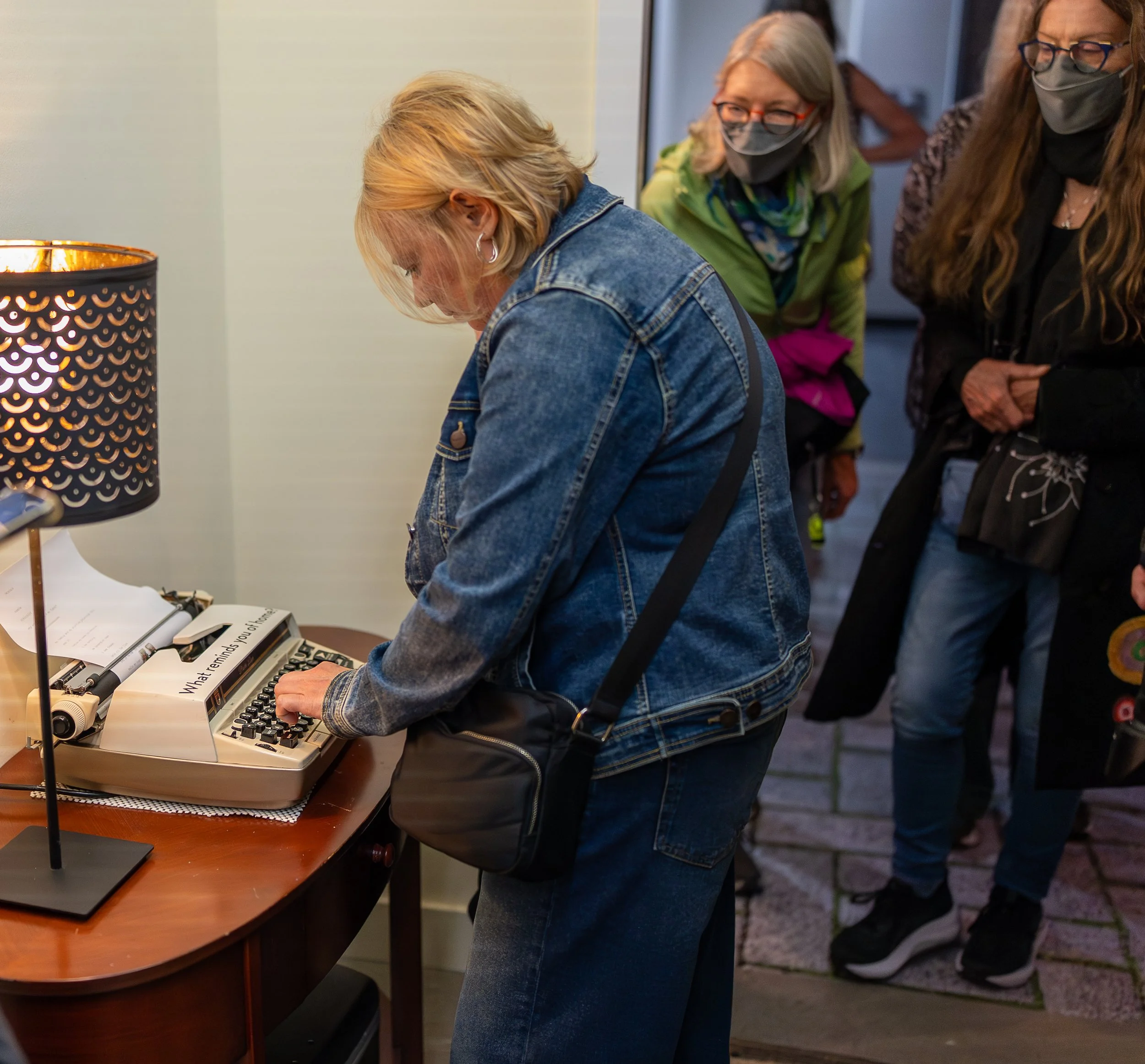 A woman typing at a typewriter