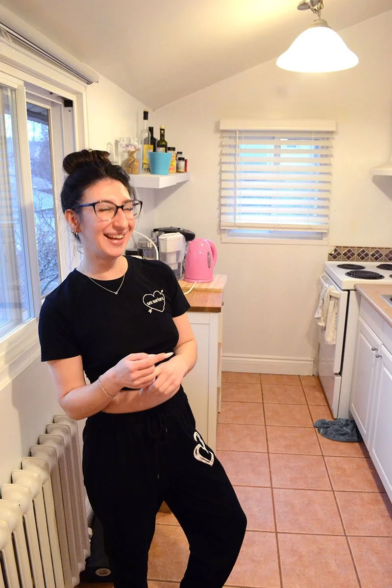 Goddess Freya Fae laughing in her kitchen