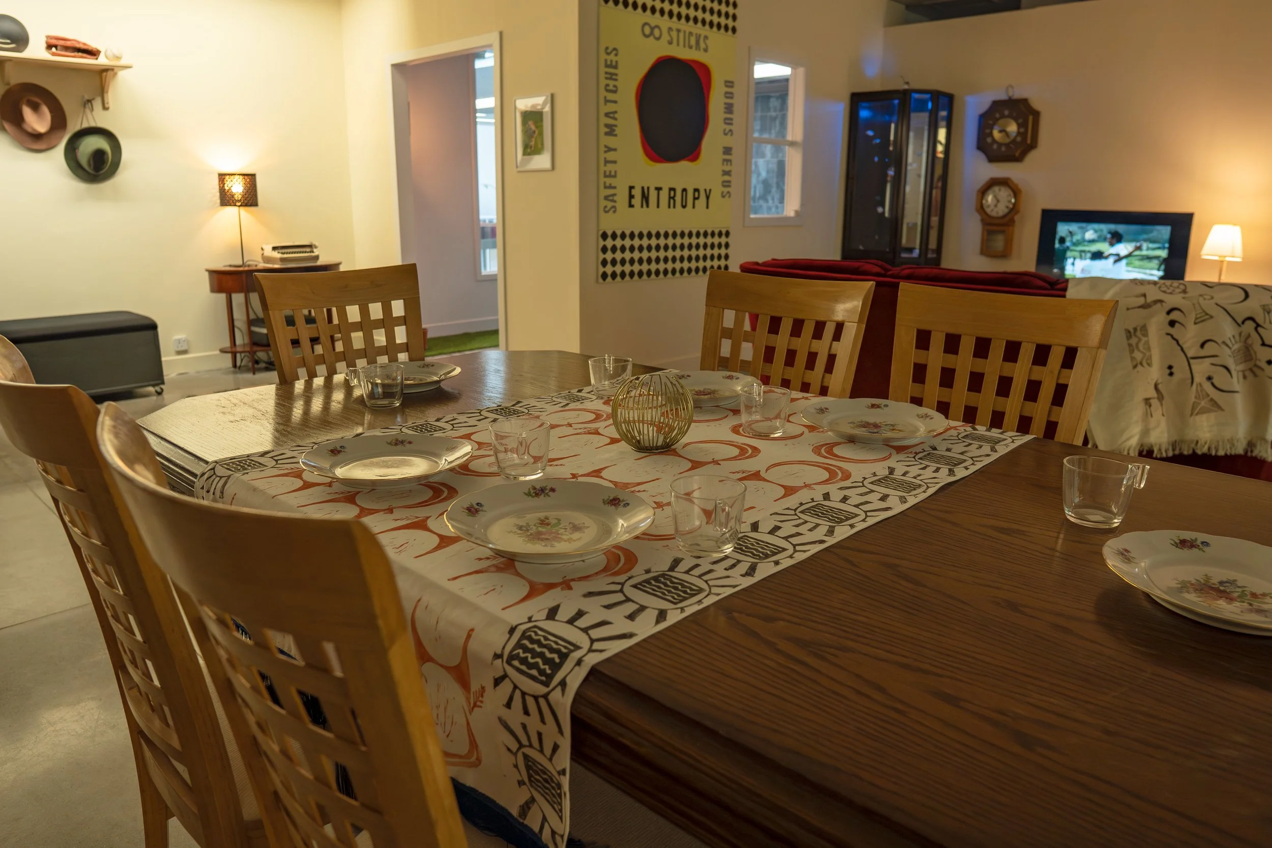 A family dining table, set for dinner.