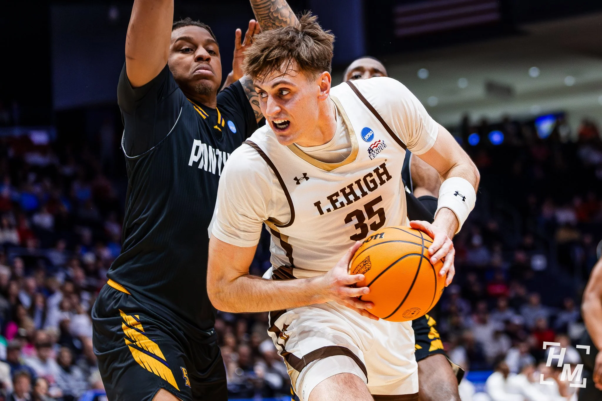 Lehigh basketball player being defended by Prairie View A&M Player