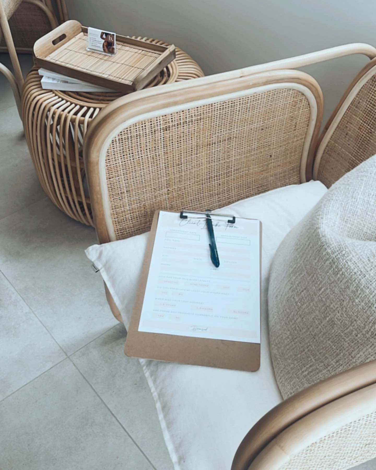 Bronzed Beauty & Wellness first appointment onboarding form on seat  in greeting room.