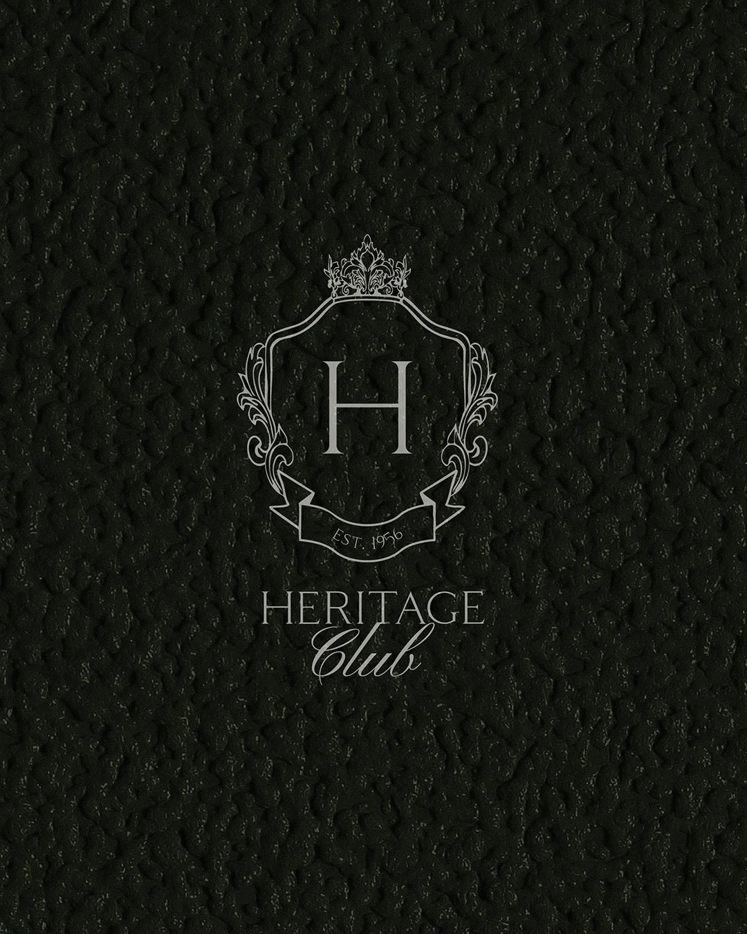 Heritage Club logo on patterned dark background