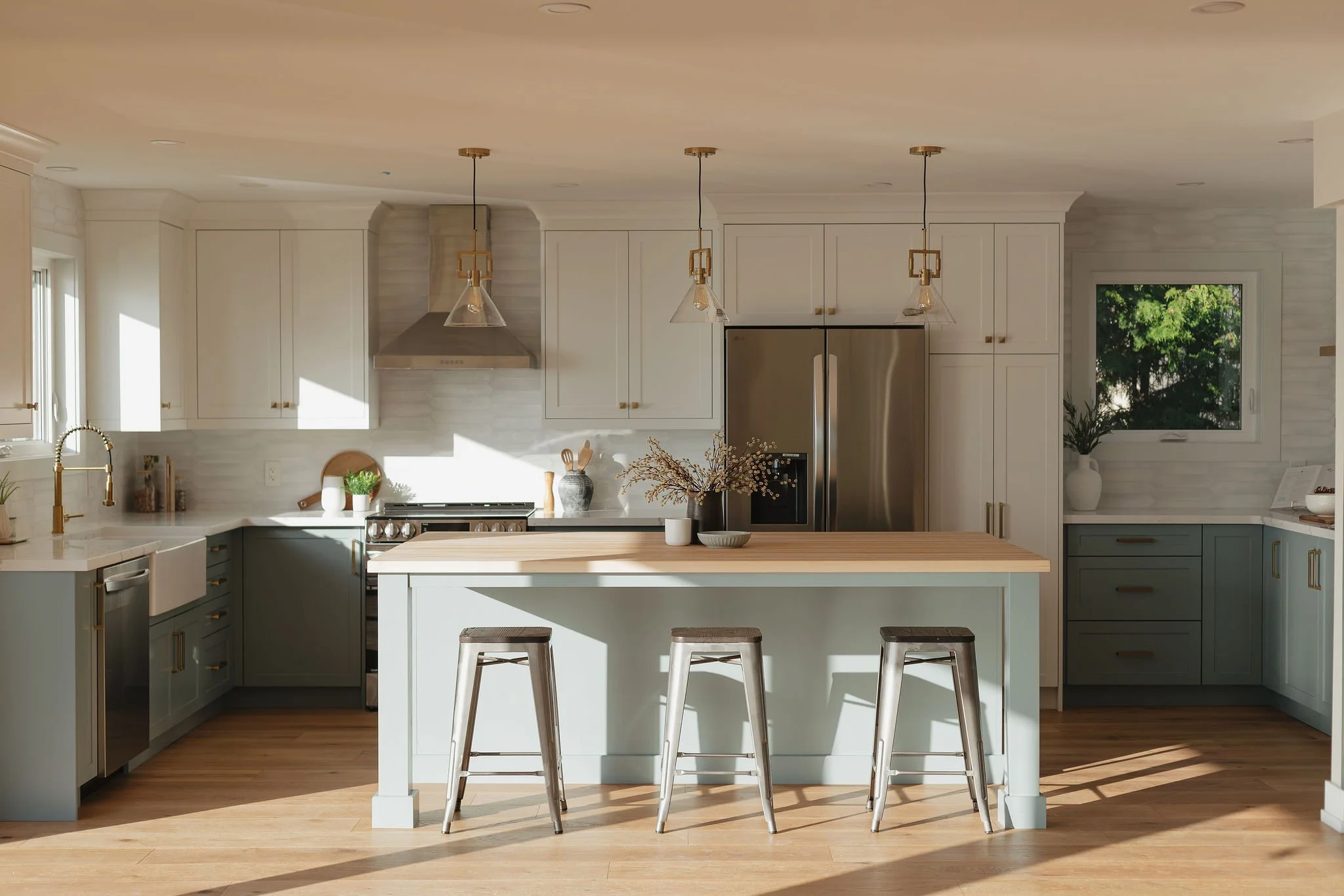 Two-tone kitchen with sage lower cabinets and white uppers, Stoney Creek Ontario kitchen remodel by independent designer K12 Designs