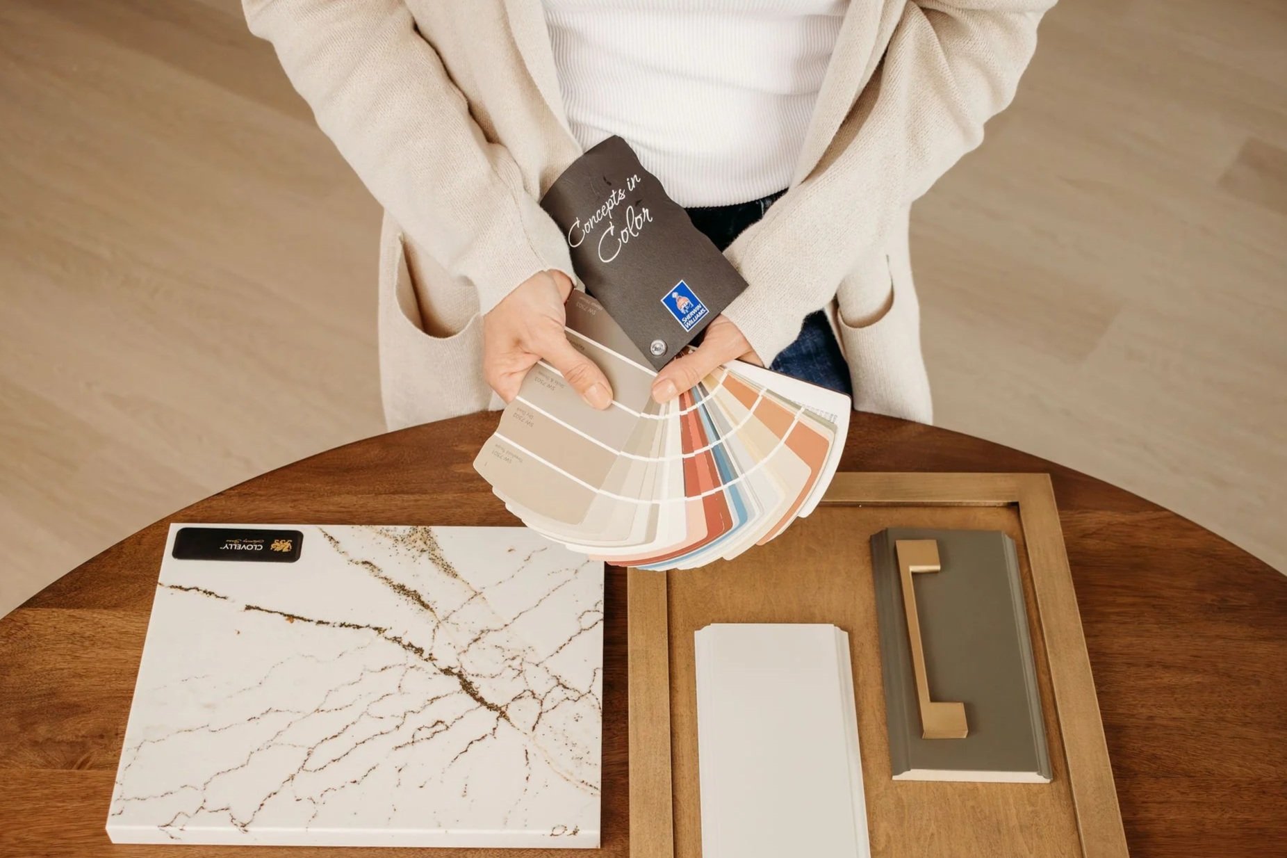 Independent kitchen designer reviewing cabinet specifications with Niagara homeowner, K12 Designs