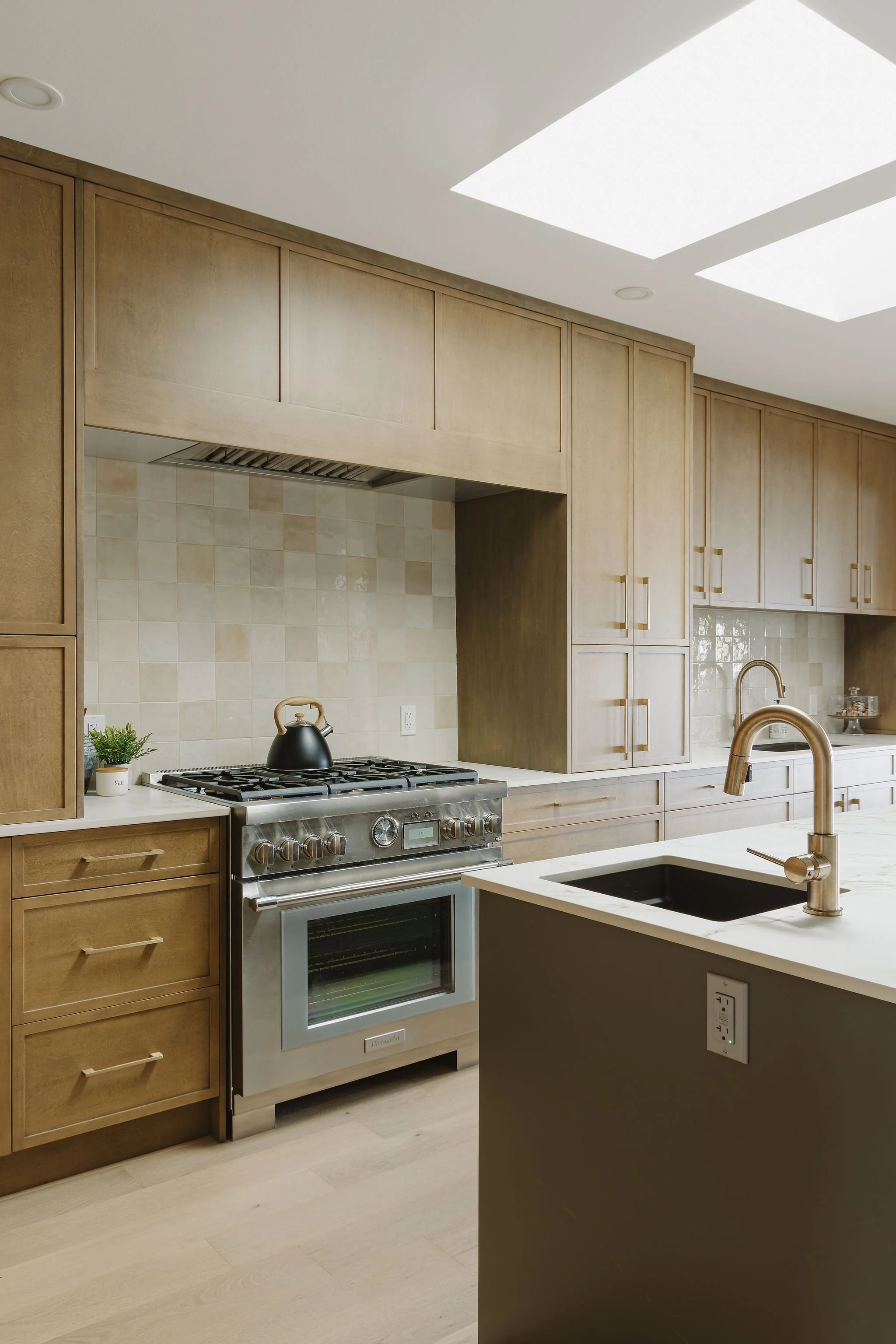 Professional 36" Thermador gas range, maple cabinetry, Dekton Entzo countertops, St Catharines