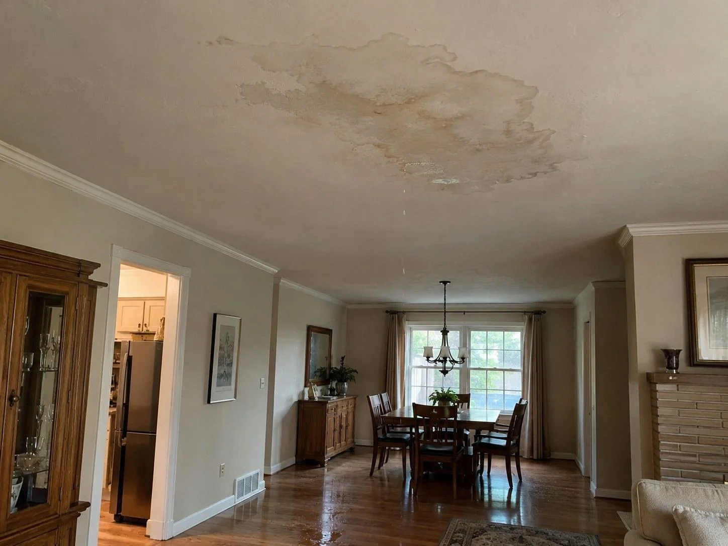 Water stain on a ceiling below a bathroom in a Prairie Village, KS home