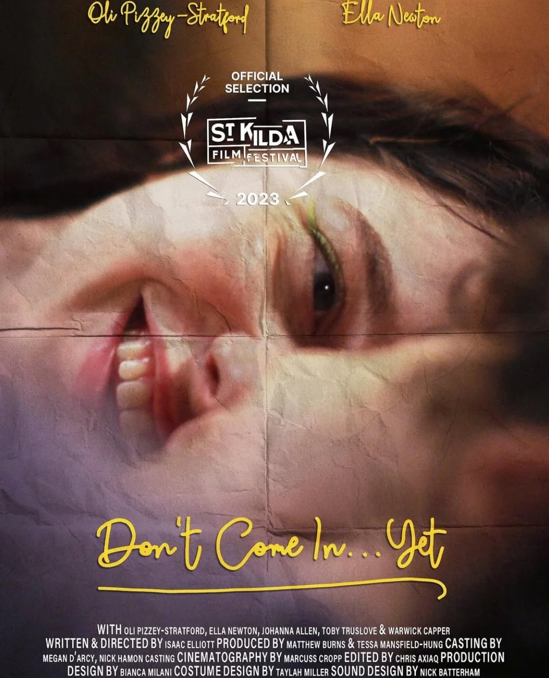 Poster for a film titled 'Don't Come In... Get' featuring a distorted image of a person's face with messy hair, one eye visible, and a smiling mouth. The poster includes the names Oli Pizzey-Stratford and Ela Newton at the top, mentions the film's se