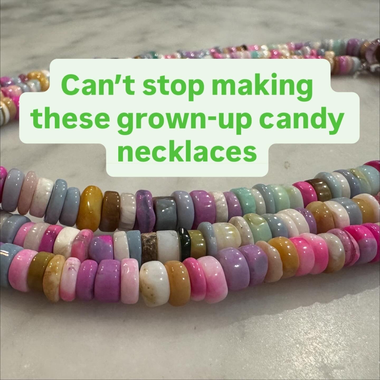 Colorful grown-up candy necklaces arranged on a surface with a caption saying 'Can't stop making these grown-up candy necklaces'.