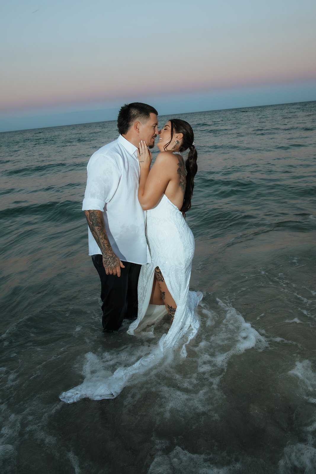 Bride and Groom kissing in the ocean after they eloped in Dunsborough W.A
