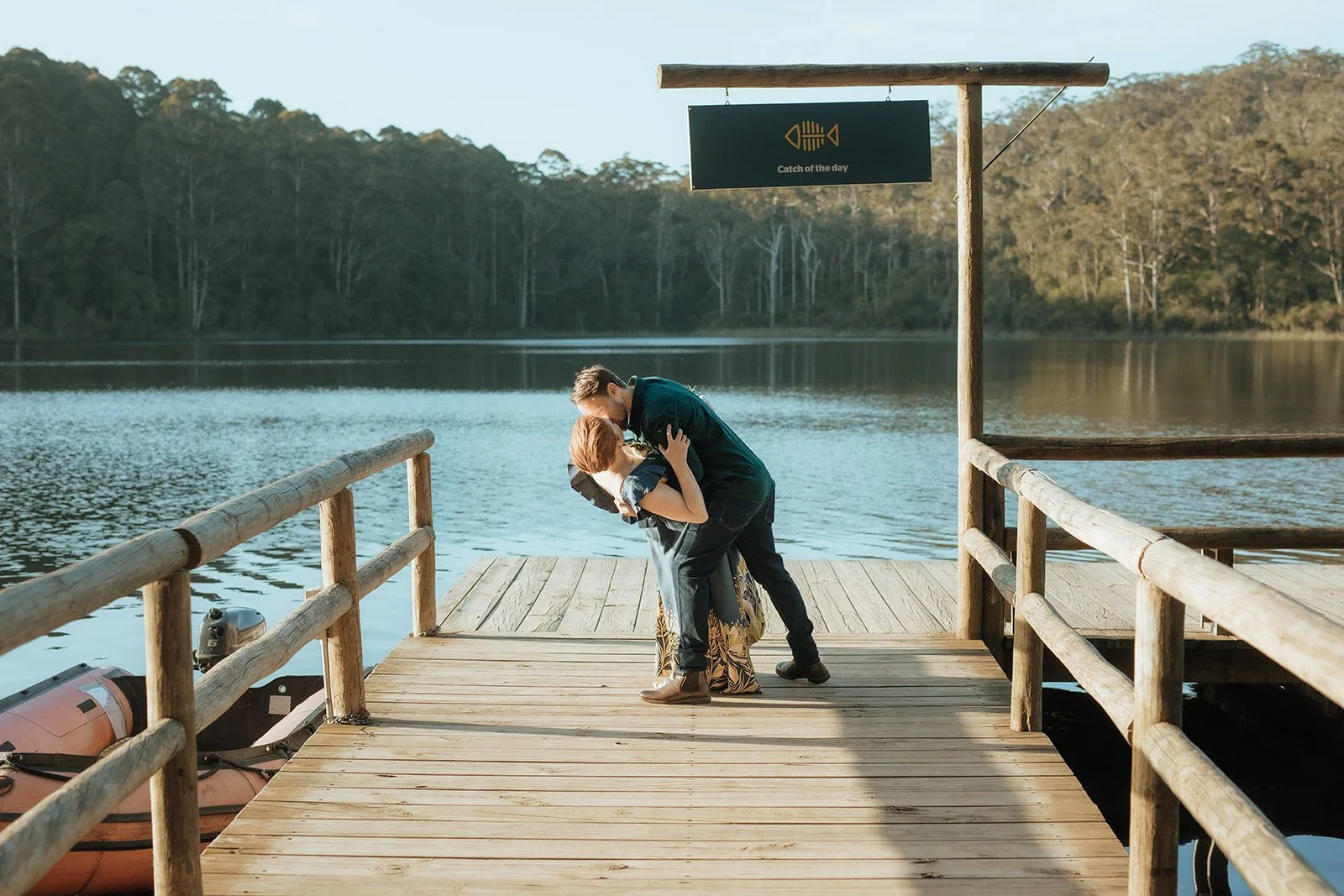 Bride and Groom at Karri Valley Resort in W.A sharing a dip kiss on the jetty after they eloped