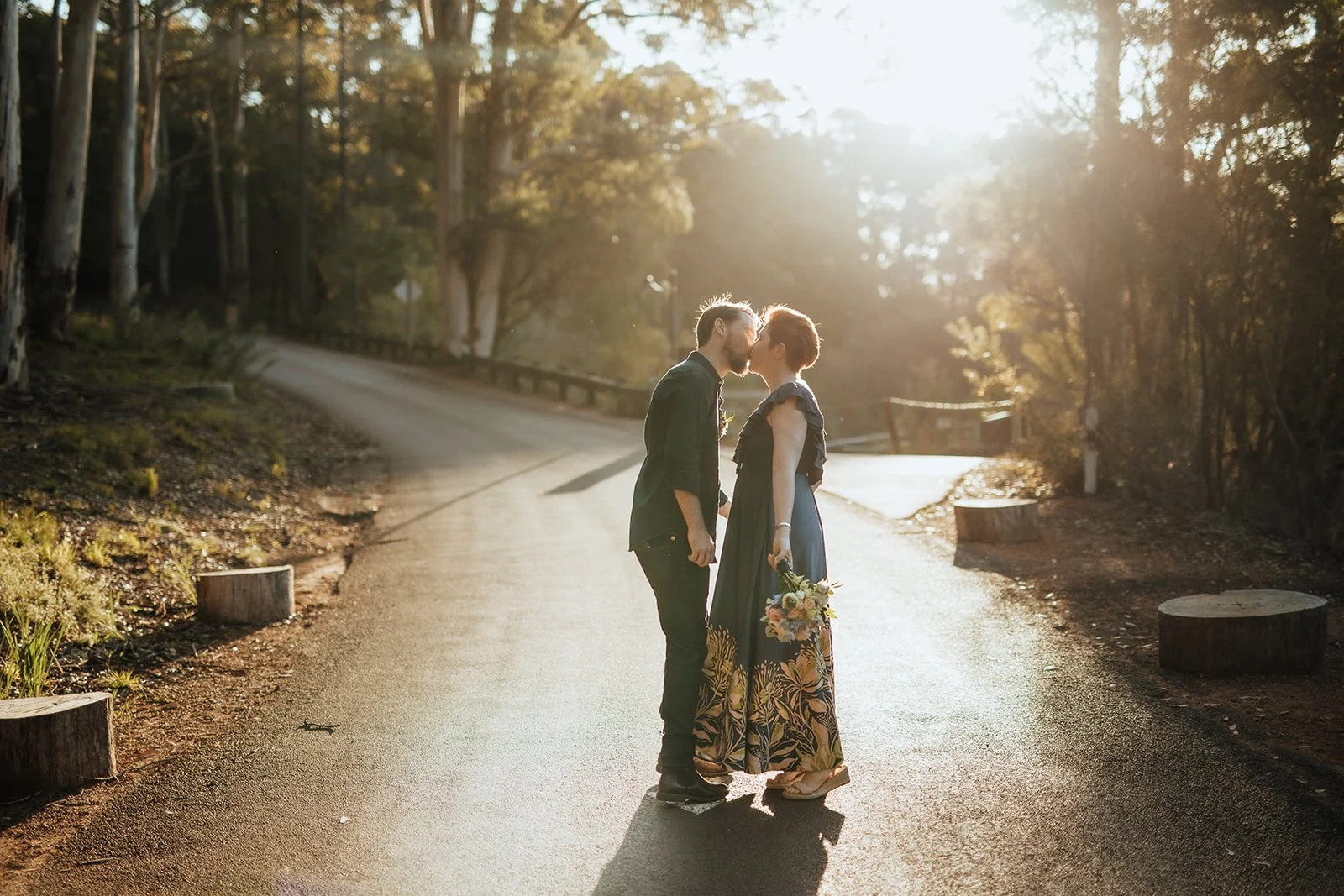Bride and Groom at Karri Valley Resort in W.A dancing on the road in lovely light after they eloped