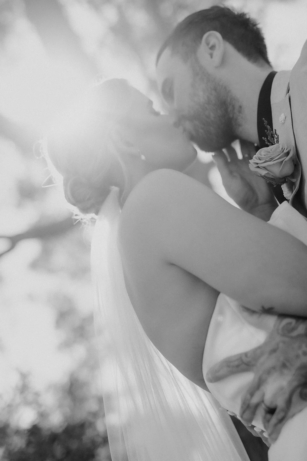 Bride and Groom on their elopement day at Bina Maya Retreat in Quedjinup W.A kissing under the trees in perfect lighting