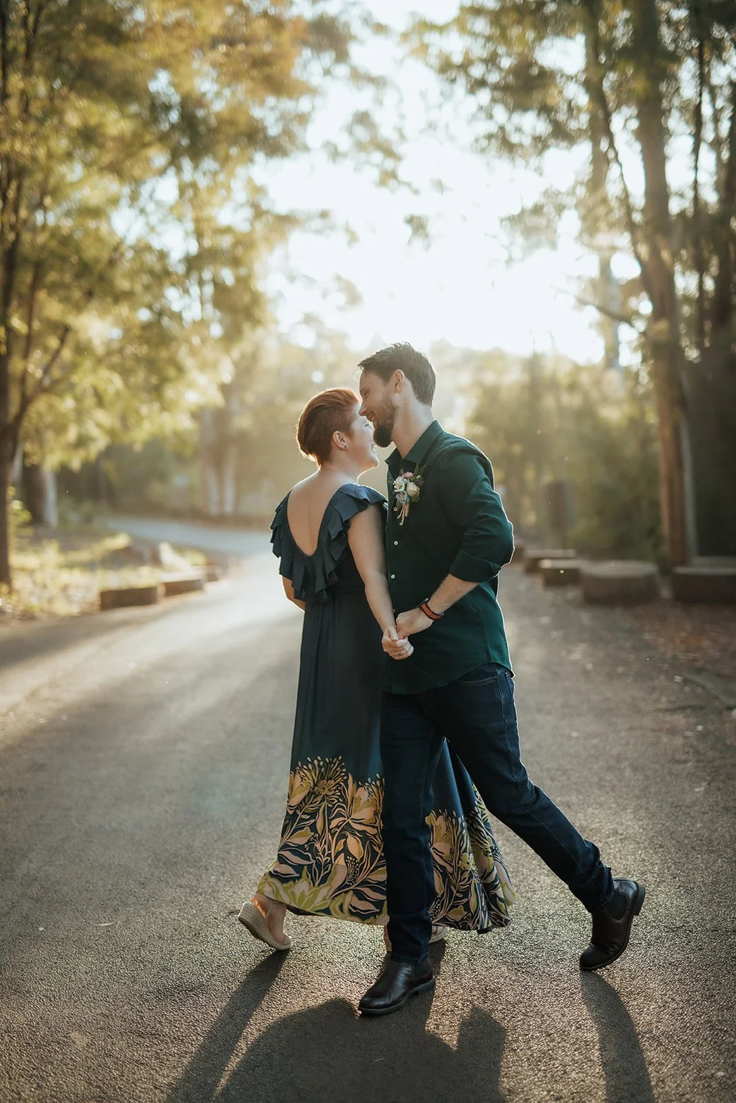 Bride and Groom at Karri Valley Resort in W.A dancing on the road in lovely light after they eloped