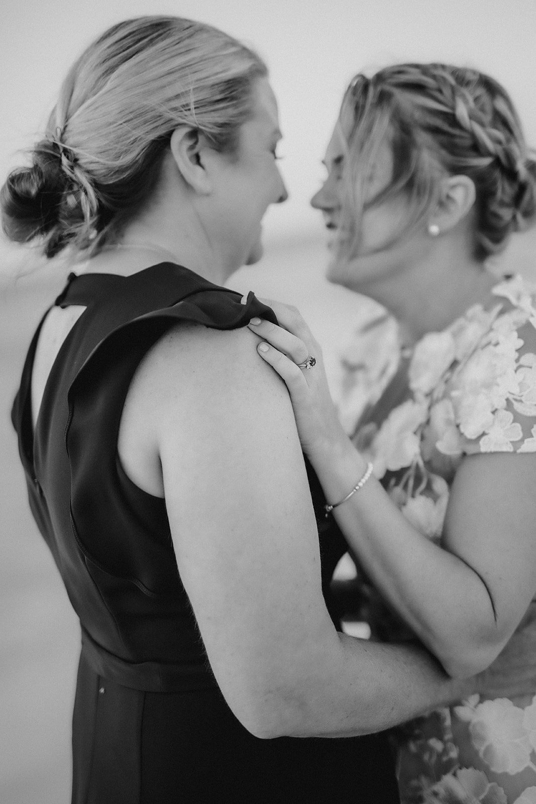 Two brides embracing on their wedding day elopement at Eagle Bay W.A