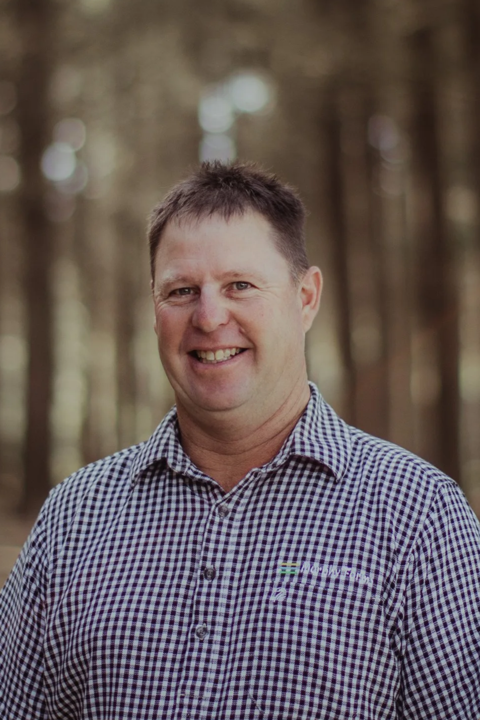 Logo for the MLG, featuring stylized text and a multicolored spherical design with green, blue, and black waves.