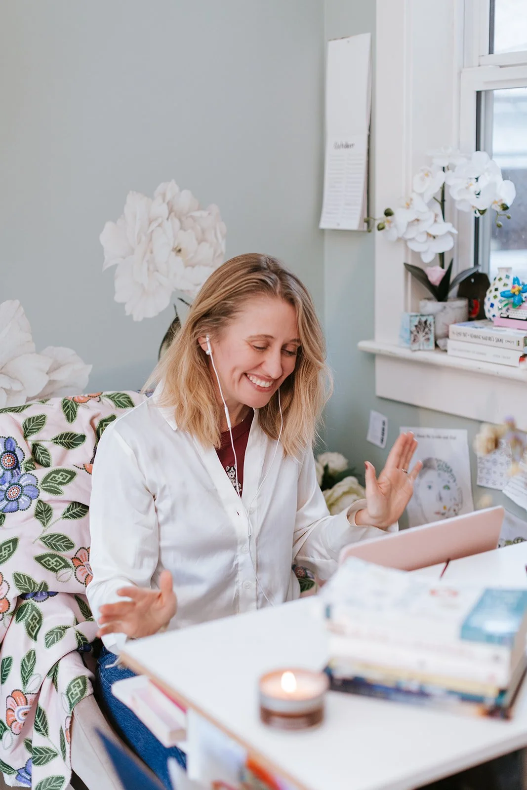 Alice Kuipers author smiling while talking to someone on laptop
