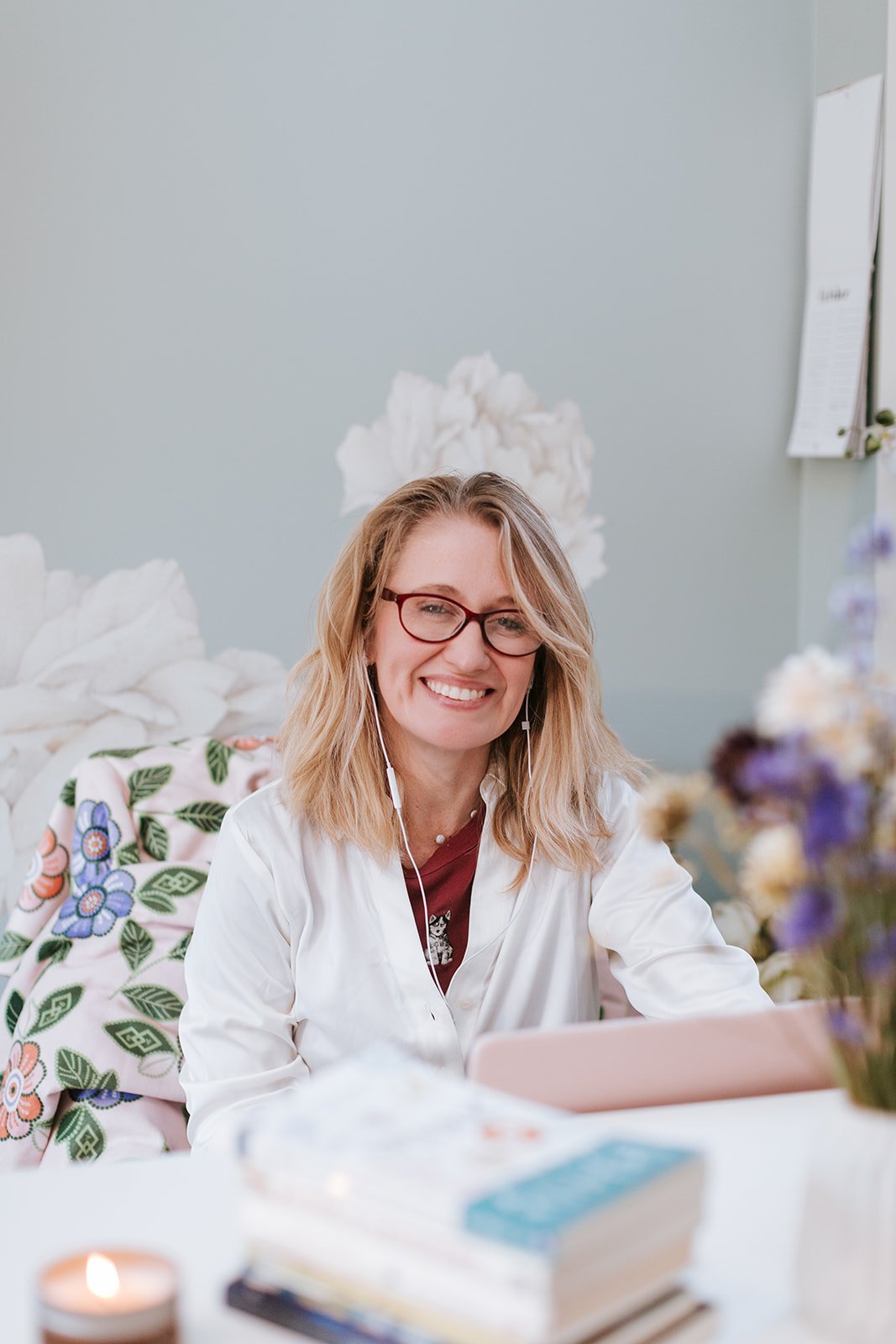 Alice Kuipers author sitting at her desk smiling