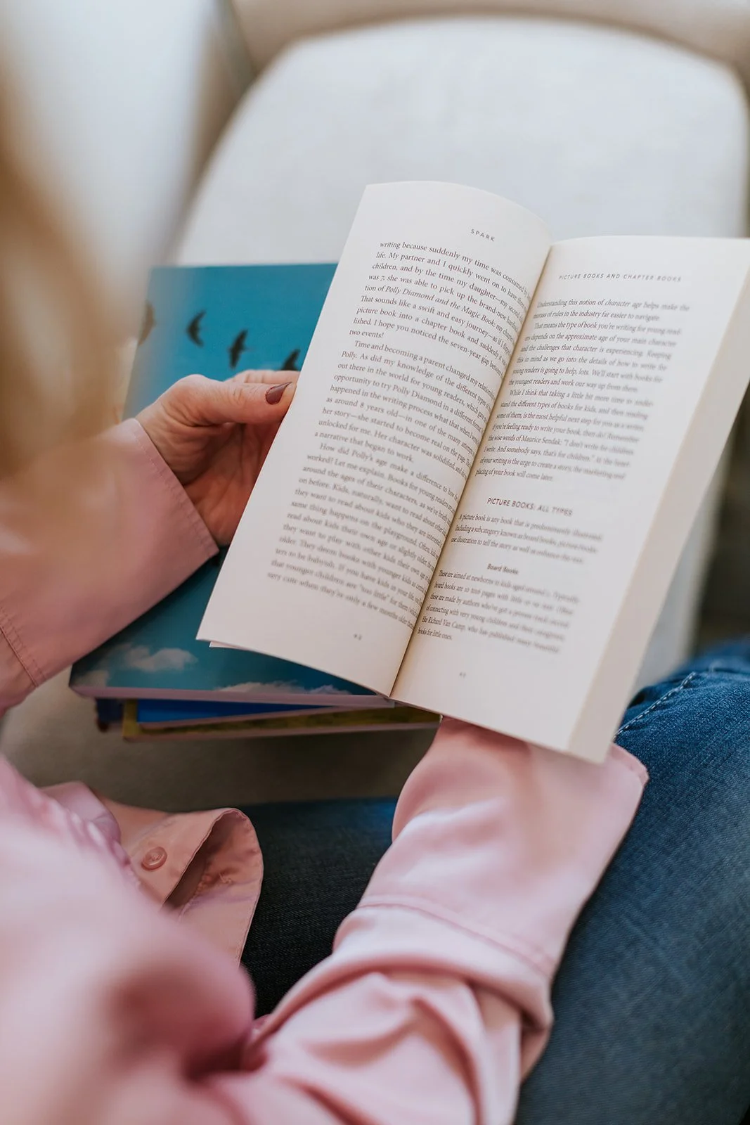 Alice Kuipers author holding a book open