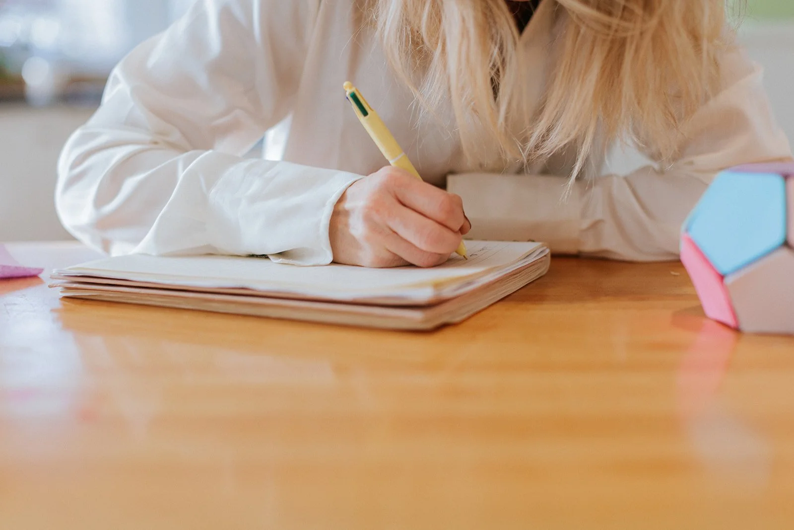 Alice Kuipers author writing on notebook