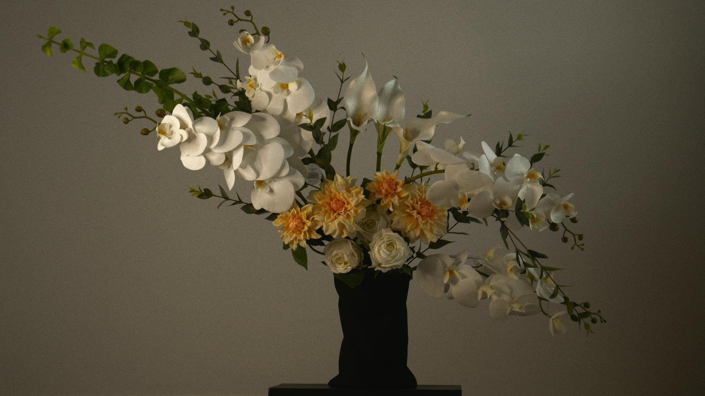 luxurious arrangement, featuring pure white, roses and orchids. Designed for elegance and sophisticated style
