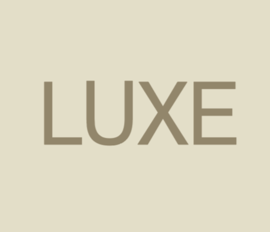 The word "LUXE" in bold, capital letters on a beige background.