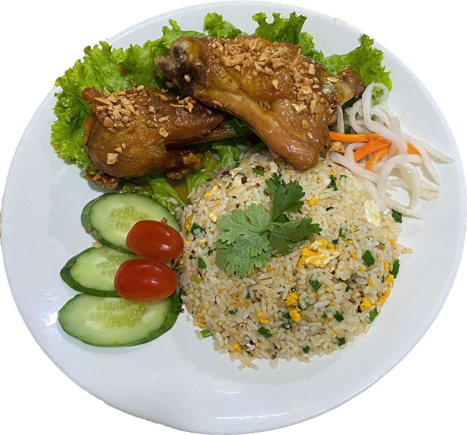 White plate with slices of cucumber and cherry tomatoes, fried rice garnished with cilantro, a lettuce leaf, and a piece of chicken topped with crushed peanuts and sauce.