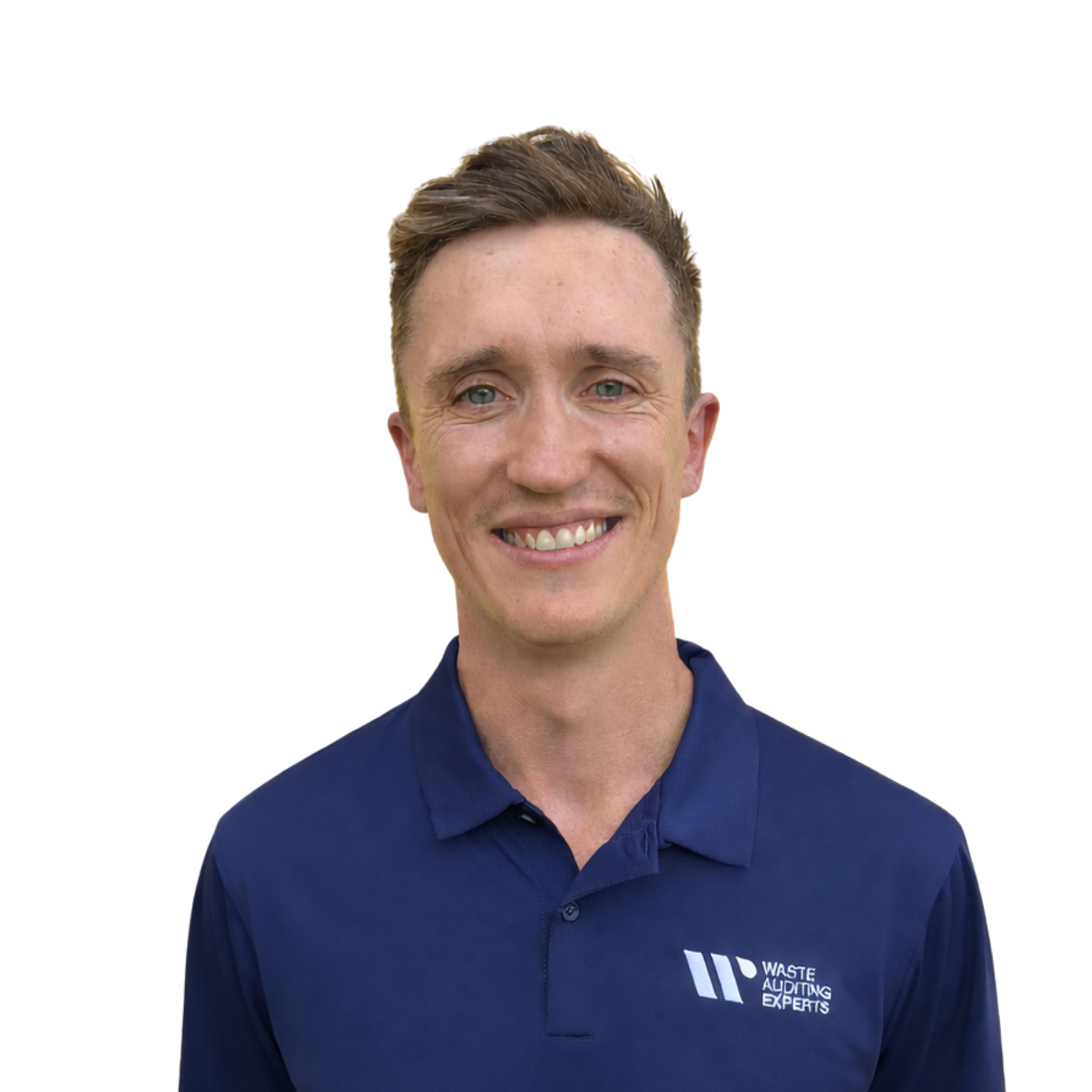 A woman with curly dark hair sitting on a bench in a room with minimalist design, dressed in a beige sleeveless sweater and taupe wide-leg trousers, looking thoughtfully to the side with natural sunlight casting shadows.