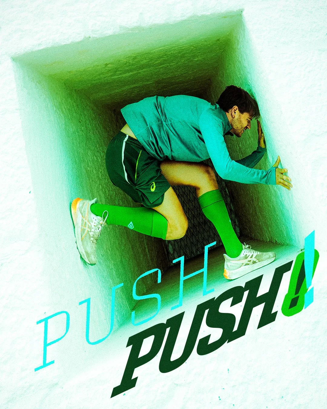 A man in athletic gear, including a green knee-high sock, is pushing against a small wall inside a narrow, green-lit tunnel.