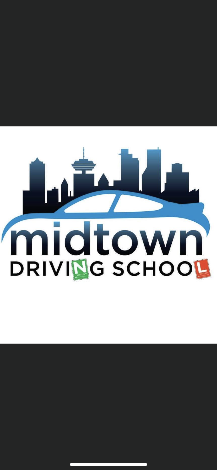 Scenic landscape of mountains, a lake, and grassy hills under a cloudy sky.