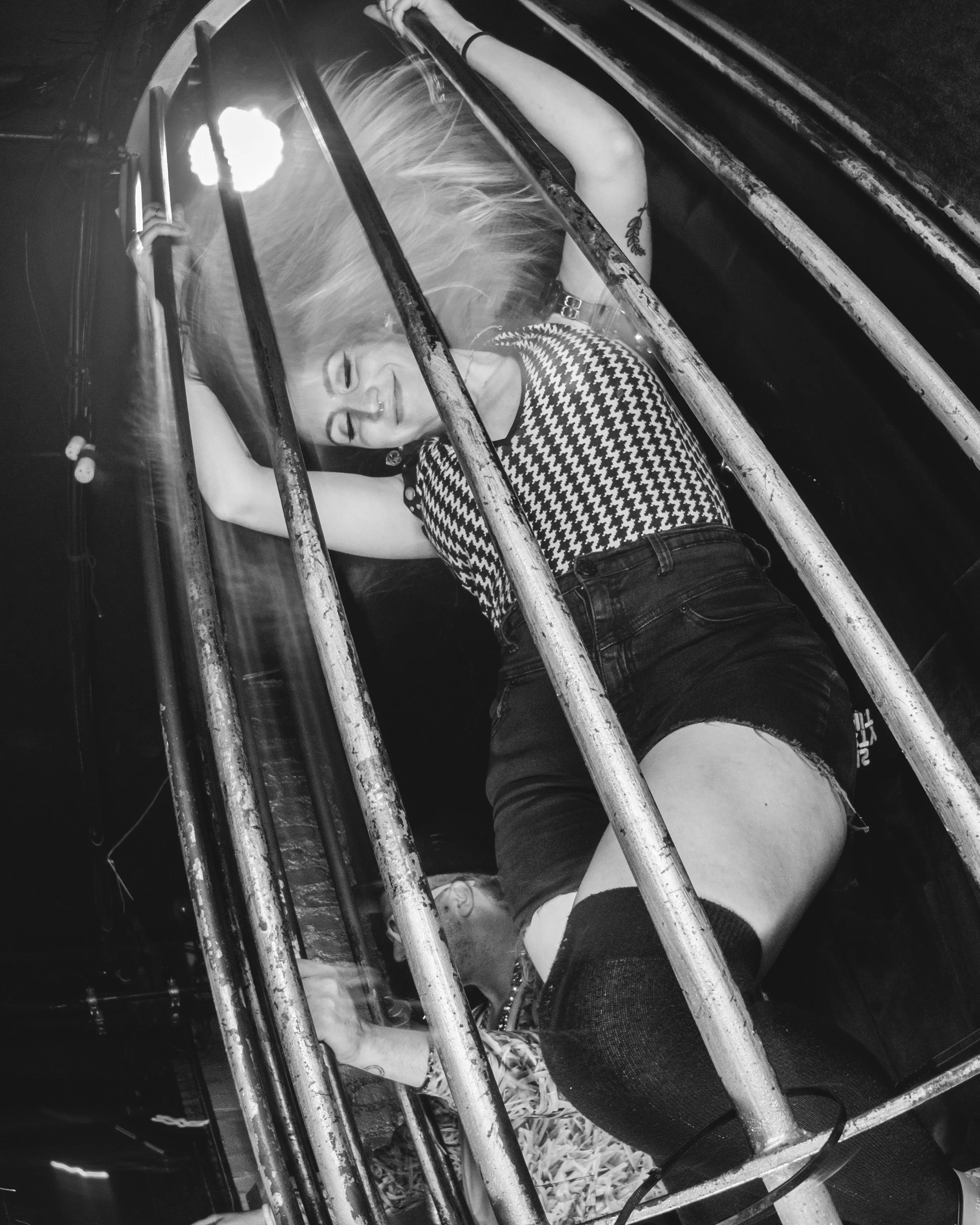 Woman dancing in the birdcage at Slake, NYC in 2016
