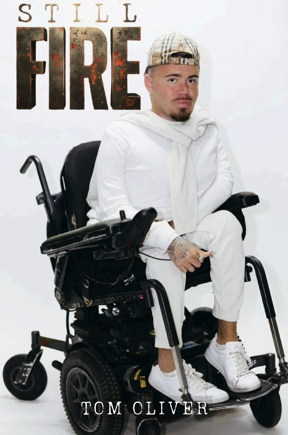 Tom in his powered wheelchair on the cover of "Still Fire".
