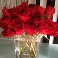 Bouquet of red roses in a glass vase.