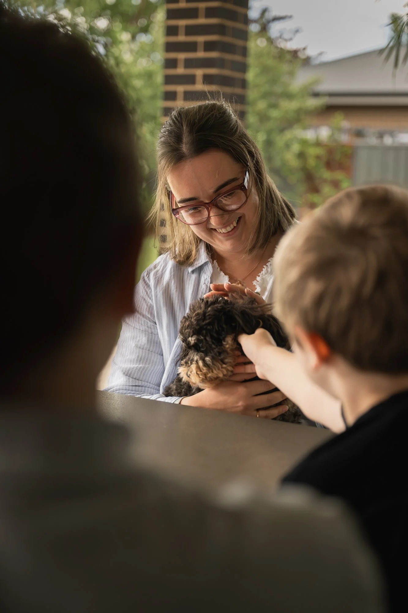 Therapist bonding with family dog