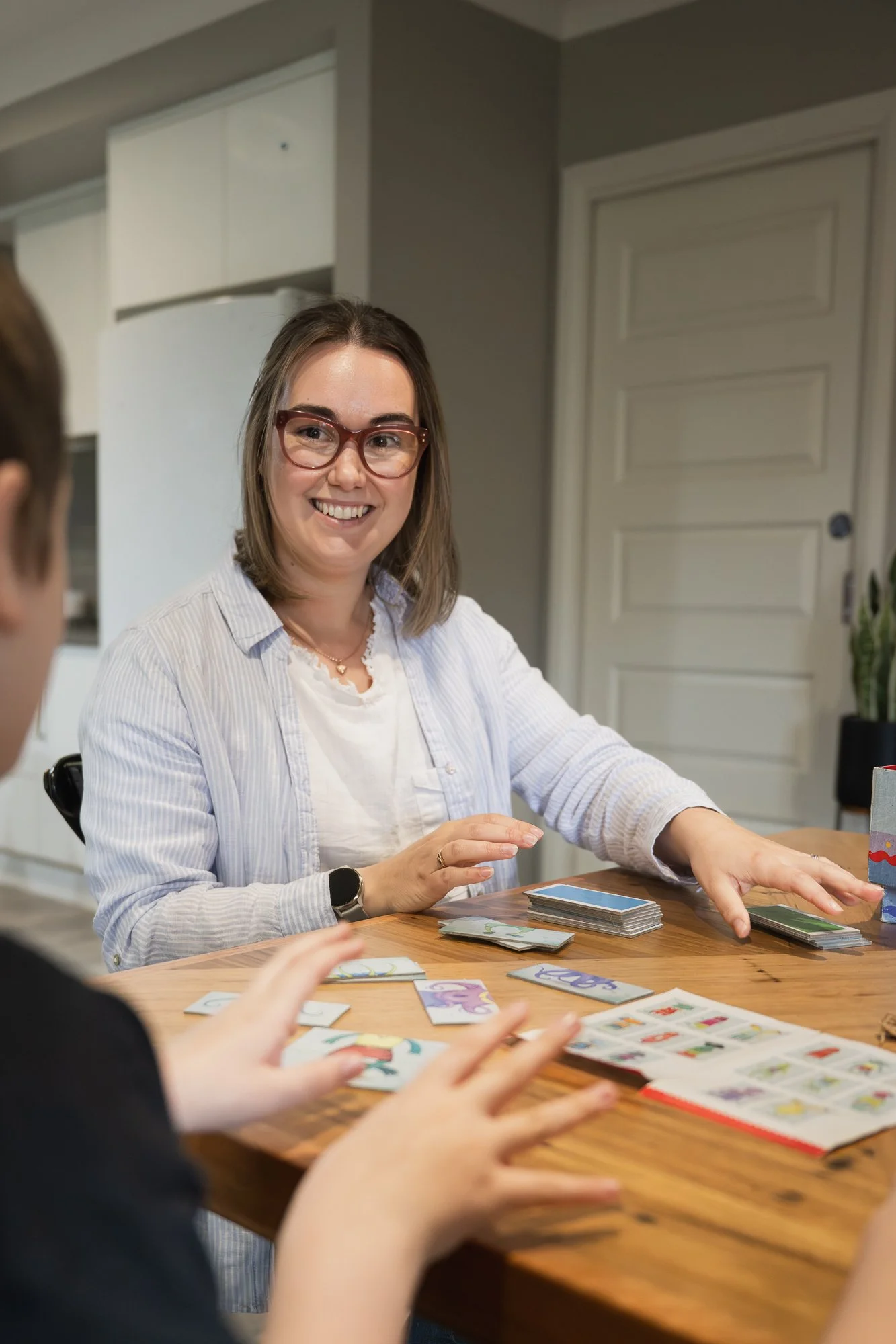 Senior Speech Pathologist during fun therapy session