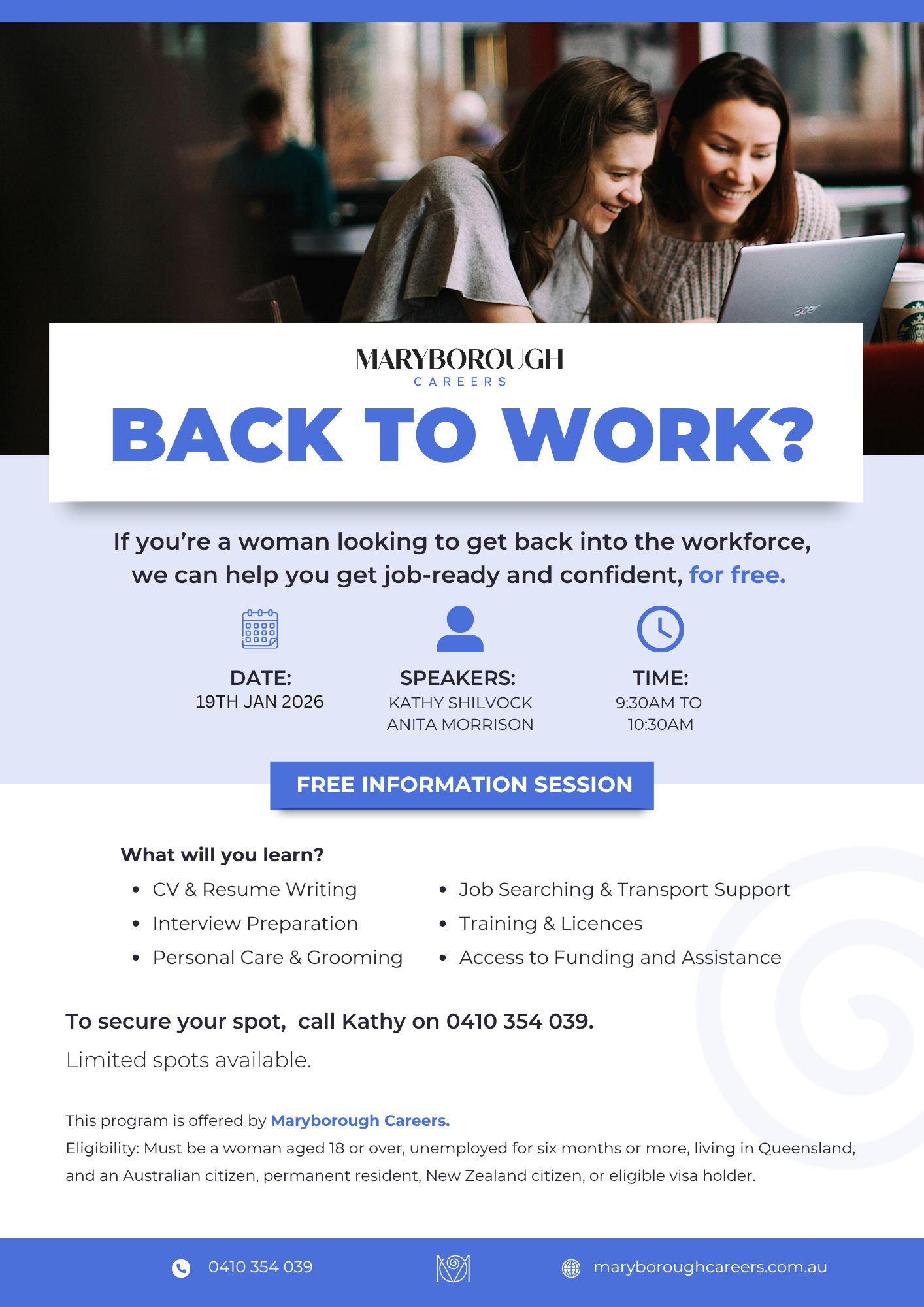 Two women sitting together in a cafe, looking at a laptop and smiling.