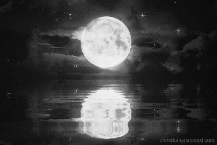 Full moon over water with reflections, partly cloudy night sky.