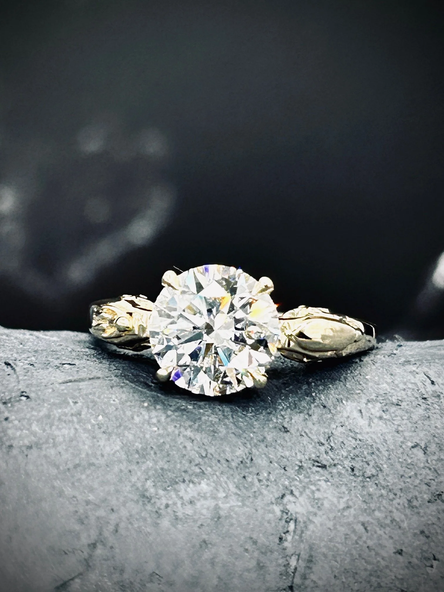 2 carat synthetic diamond in a yellow gold setting with a rocket and astronaut displayed as a space themed engagement ring