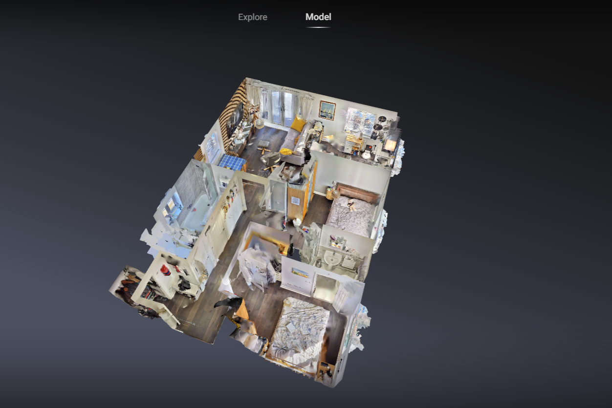 3D model of a small apartment with a living room, kitchen,  2 bedrooms, and 2 bathrooms. Created by RAB immersive.