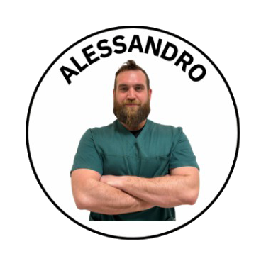 A man with a beard and short hair, wearing green medical scrubs, standing with arms crossed. The name 'ALESSANDRO' is written in black uppercase letters in a circular badge surrounding him.