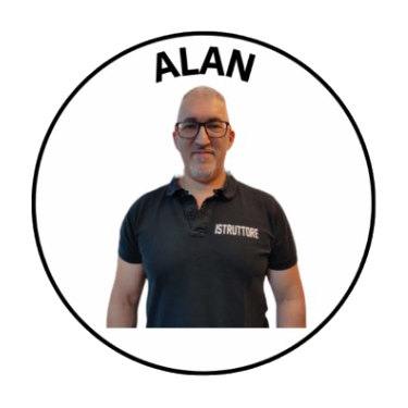 A man wearing glasses and a black polo shirt with 'ISTRUTTORE' printed on it, standing in front of a white background with a circular border and the name 'ALAN' at the top.