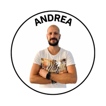 Man with a bald head and beard, crossing his arms, wearing a white t-shirt with a tiger print, inside a circle with the name 'Andrea' at the top.