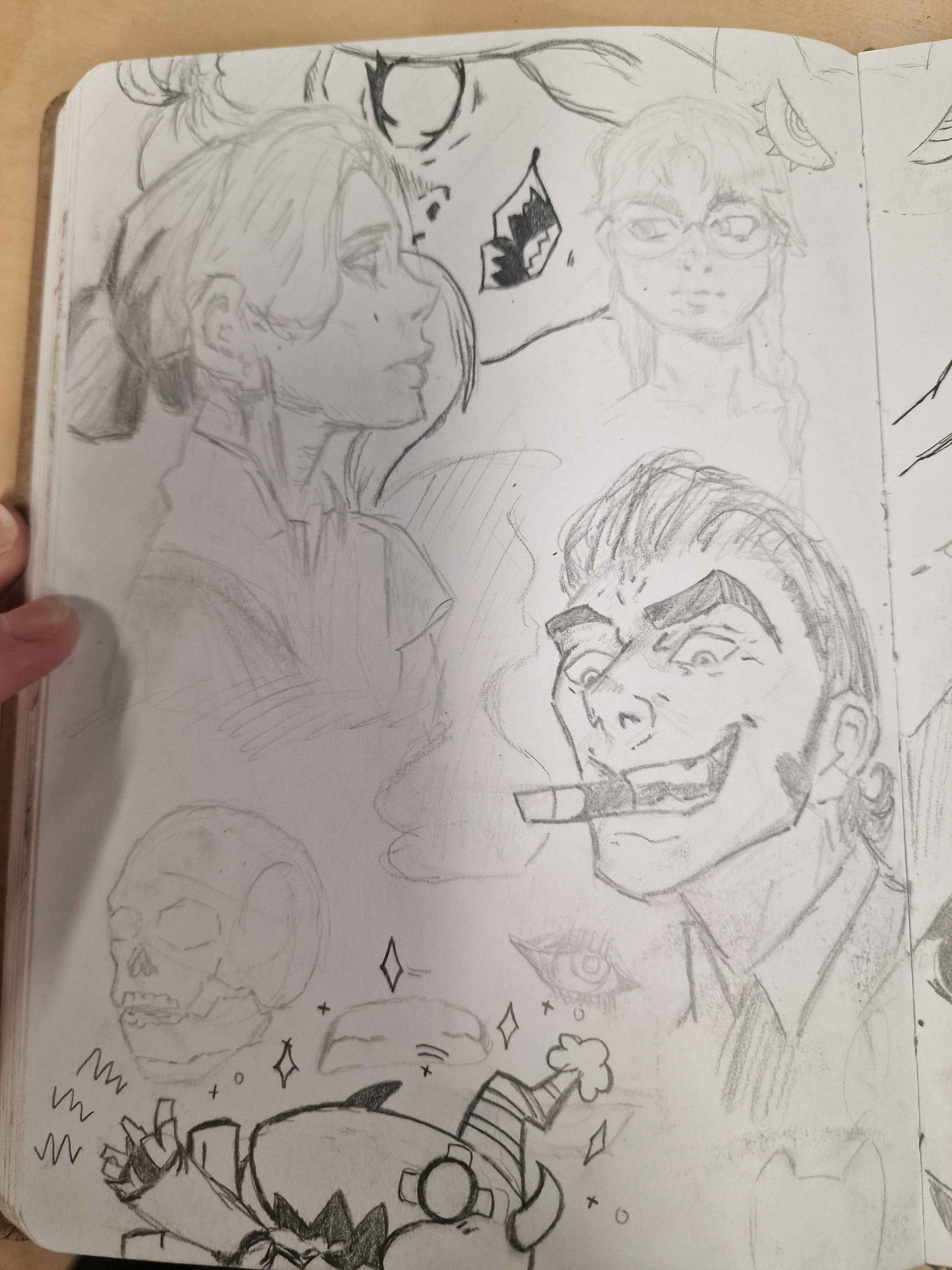 Collection of various sketches including a side profile of a woman, a person with glasses, a grinning man with a cigar, a skull, a stylized creature, and other small doodles.