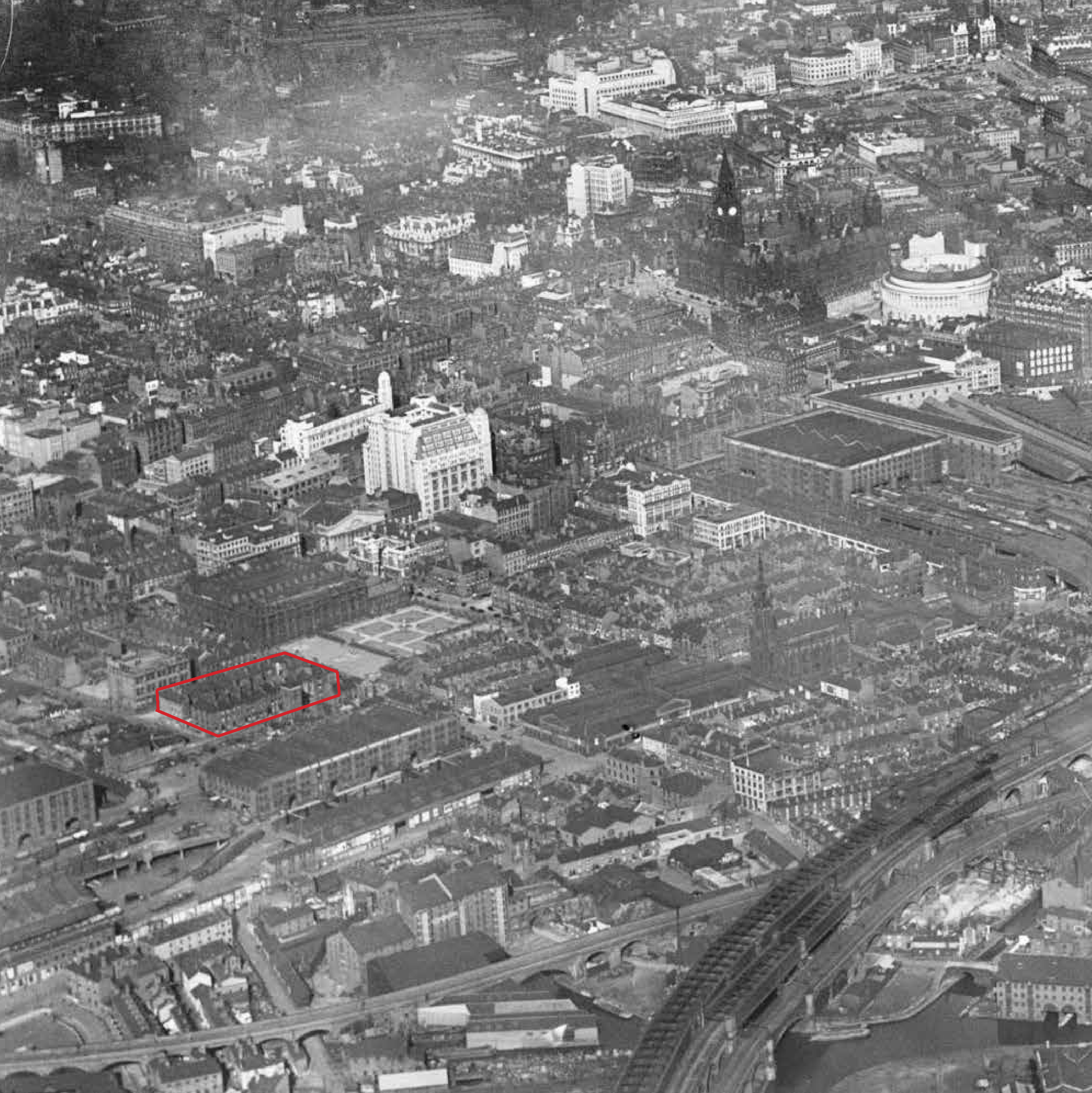 Aerial view of downtown city with many buildings, roads, and railways, including the Big Ben clock tower in London, UK.