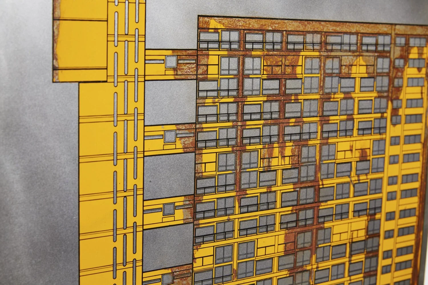 Diagram or architectural rendering of a multi-story building with a yellow exterior, black window frames, and open balcony areas, showing structural details and rust stains.