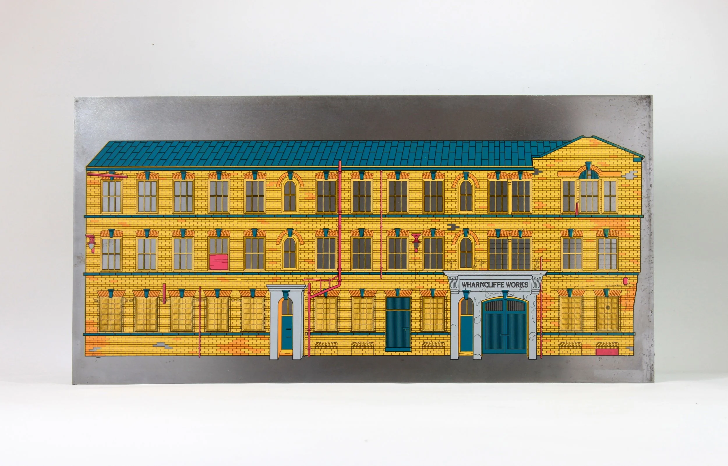 Colorful illustration of a yellow brick building with blue doors, windows, and roof, labeled 'WHARRCLIFFE WORKS' above an entrance archway.