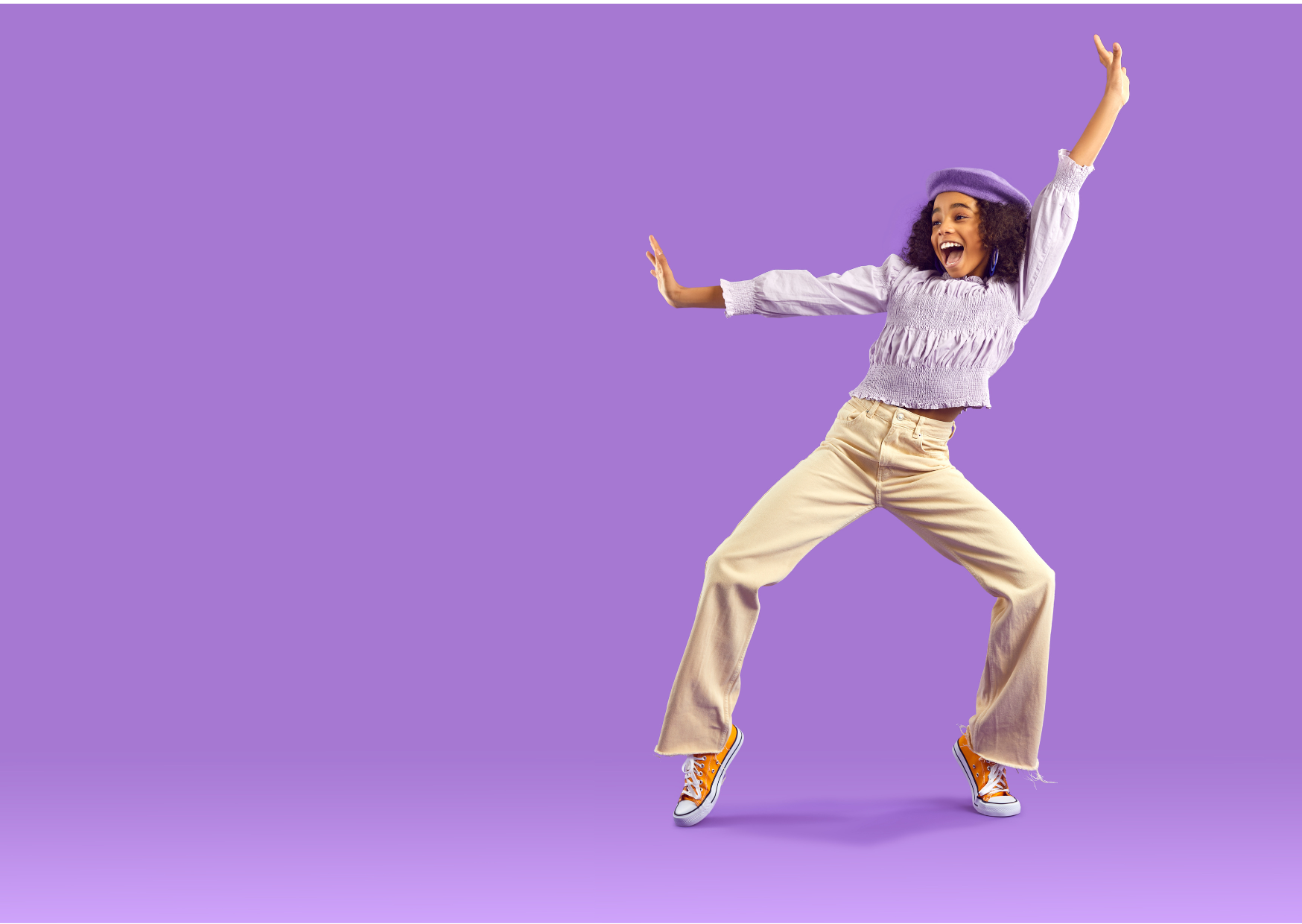 Image with a purple background of a girl wearing purple excitedly dancing
