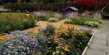 Garden planting scheme with colourful perennial meadow planting in Burley, New Forest.